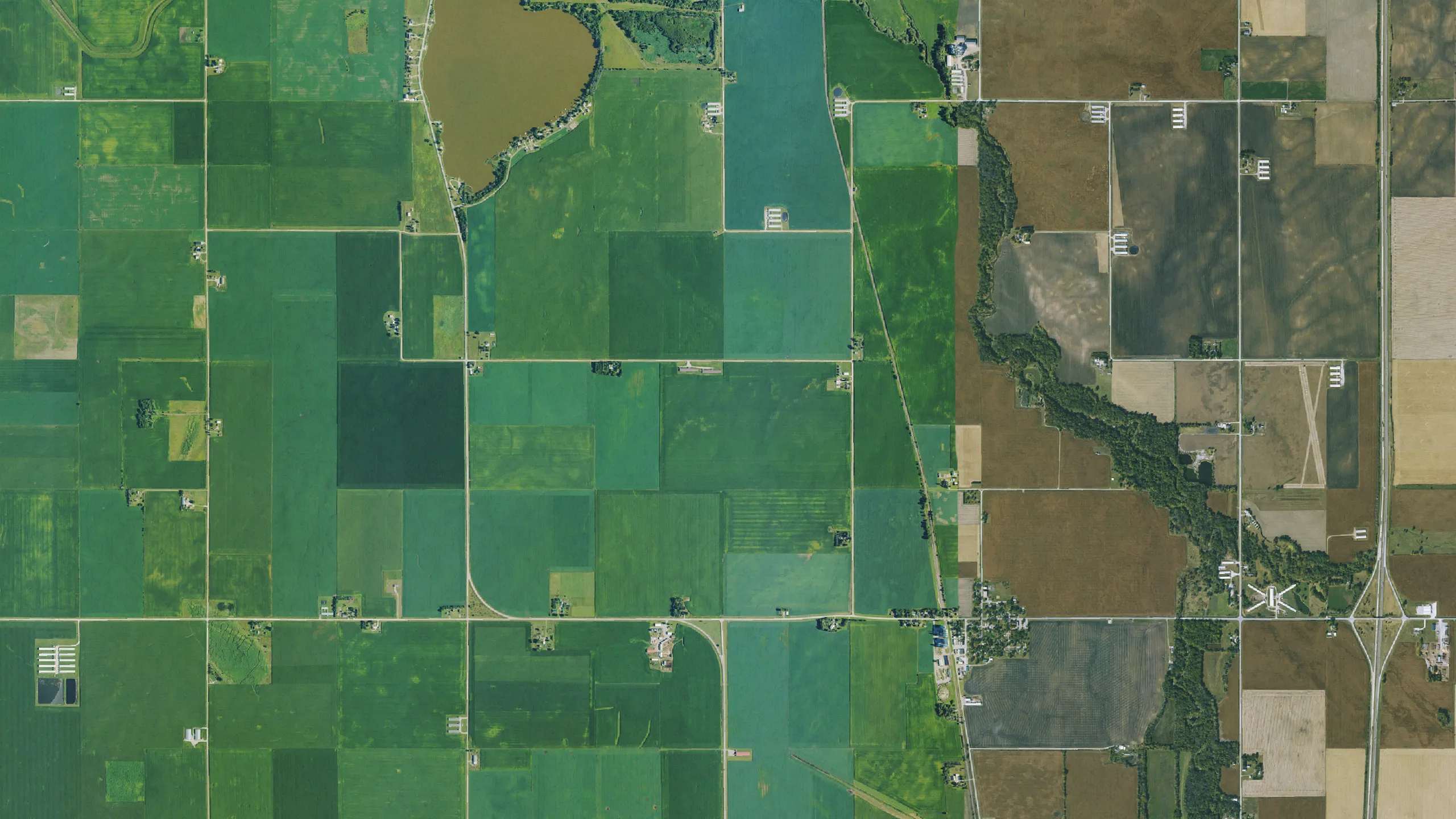Aerial view of square corn and soybean fields in central Iowa